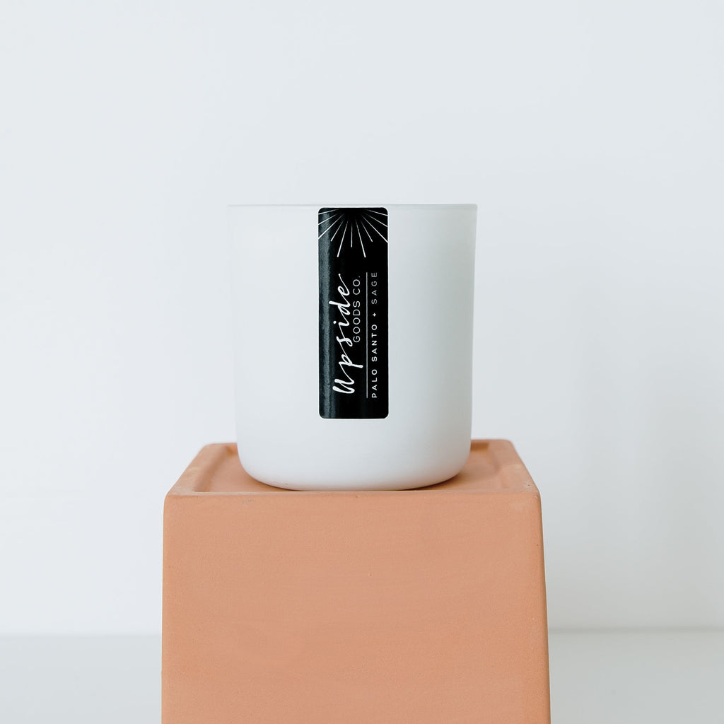 Palo Santo + Sage Signature candle from Upside Goods and the benefits of burning this scent in your home or space. 